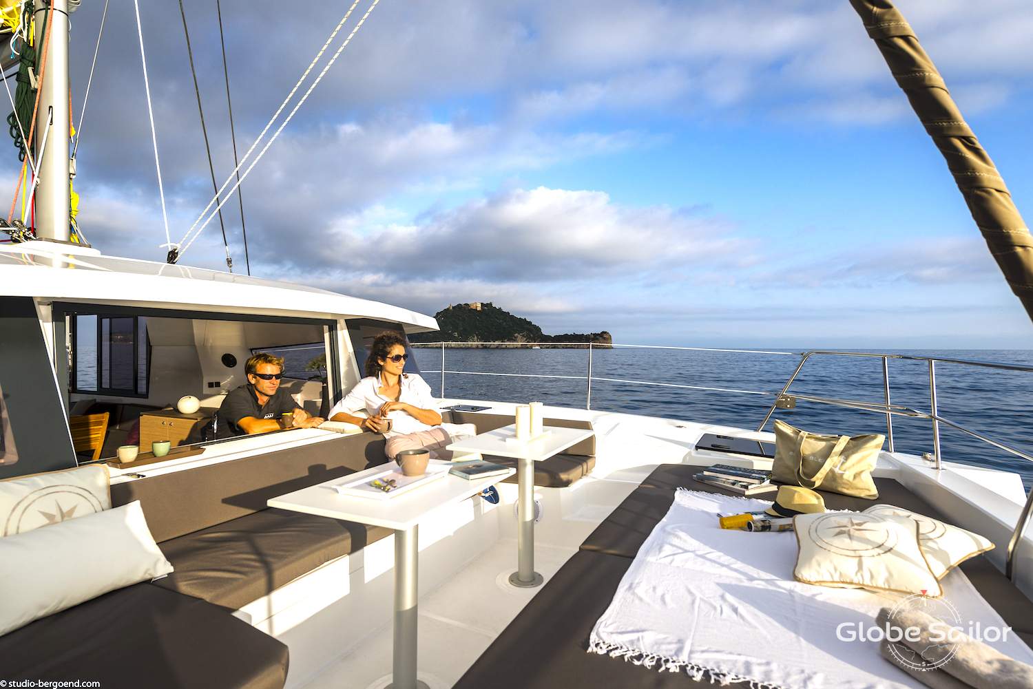 Relax at the front of the catamaran and catch the sunset